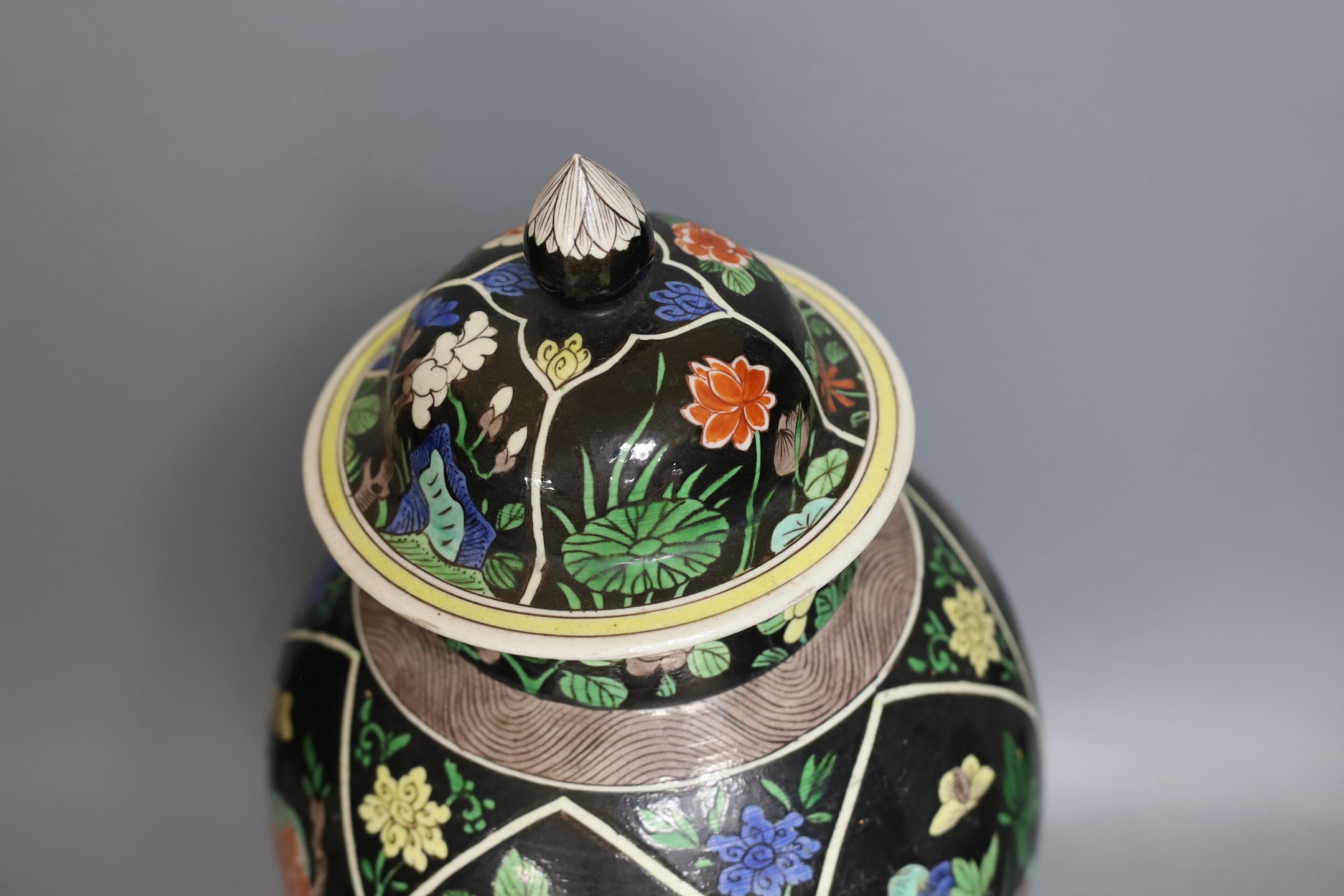 A late 19th century Chinese famille noire enamelled biscuit baluster vase and cover, 49cm high